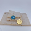 Detail of blue enamel coin pendant with star and moon charms on travertine stone - Single Pendant / Star Moon Blue Pendant