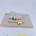 Macro detail of blue enamel elephant charm and gold evil eye pendant on stone surface - Single Pendant / Blue Evil Eye Elephant Pendant (20x21mm)