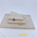 Macro detail of star-shaped evil eye pendant with gold plating and blue enamel inlay - Single Pendant / Blue Evil Eye Star Pendant (16x21mm)