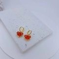 Close-up of golden heart earrings with bright red zircons on a white stone base - Earrings Only (Without Necklace) (Red)