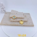 Golden heart charm with evil eye zircon inlay and honeycomb back view on stone - Golden Heart Rhinestone Style (#4)