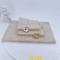 Detailed view of heart-shaped evil eye charms with mother of pearl and gold plating - Heart Mother of Pearl Inlaid Style