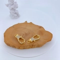 Close-up of gold lobster clasps with micro-pave cubic zirconia on wooden surface - Gold Classic Lobster Clasp (#5)