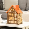 Wooden Christmas advent calendar house with 24 drawers and LED lights on white table - Wooden House LED Countdown Calendar