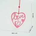Detail of pink wooden Ferris wheel heart ornament with Love engraving and couple silhouette - 9x0.3x10 / Pink