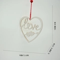 Macro detail of wooden heart pendant with Love carving and red bead hanging rope - 9x0.3x10 / White