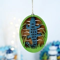 Detail view of a wooden blue lizard wall hanging with green frame and rustic hemp rope - Crocodile