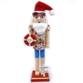 Detail of tropical wooden nutcracker with floral shirt and Christmas in July sign - Santa Hat Lifebuoy Christmas in July Signpost Style (Walnut-050)