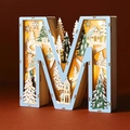 Macro view of M-shaped wooden 3D light box with winter forest scene and warm LED - Letter M