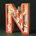 Detailed view of LED wooden letter N featuring a layered winter forest and reindeer scene - Letter N