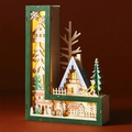 Detail of laser-cut 3D wooden letter L lamp featuring warm LED lights and a winter snow scene - Letter L