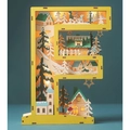 Close-up of wooden letter F LED lamp with 3D winter village scene and warm lights - Letter F