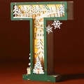 Detail of wooden letter T lamp with LED snowy forest scene and warm lighting - Letter T