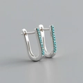 Macro shot of S925 sterling silver huggie earrings with inlaid turquoise cubic zirconia - Style A (Silver)