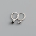Macro shot of S925 sterling silver hallmark and black gemstone pendant on hoop earring - Black Zirconia (Platinum Base)