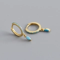Close-up of gold S925 huggie earrings with marquise-cut blue stones and micro-pave crystals - 925 Silver / Turquoise (Gold)