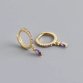 Macro view of gold hoop earrings with purple marquise-cut zircon stones and pavé setting - 925 Silver / Amethyst Purple (Gold)