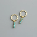 Close-up of golden S925 sterling silver hoop earrings with inlaid sky blue gemstones - 925 Silver / Lake Blue Zirconia (Gold)