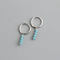 Detail of 925 silver hoop earrings with four graduated blue zircon stones in a vertical drop - 925 Silver / Lake Blue Zirconia (Silver)