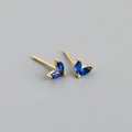 Macro shot of s925 silver leaf earrings with marquise dark blue cubic zirconia stones - Blue (Gold)