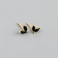 Macro detail of gold earrings featuring two black marquise-cut stones in a leaf design - Black (Gold)