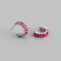 Macro detail of silver hoop earrings with princess cut rose red zircon gemstones - Red Zirconia (Silver Tone)