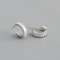 Macro shot of S925 sterling silver C-shaped earrings with square cubic zirconia inlay - White Zirconia (Silver Tone)