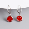 Close-up of S925 sterling silver hoop earrings with red enamel smiley face charms - Red (Platinum)