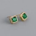 Macro view of princess-cut emerald zircon earrings with gold-plated diamond halo - Emerald Green (Gold)