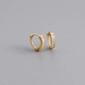 Detailed macro view of gold-plated silver huggie earrings with baguette-cut cubic zirconia - 925 Silver / Clear White (Gold)