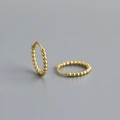 Close-up of golden S925 sterling silver hoop earrings with a beaded dot texture design - 10mm / 925 Silver / Gold