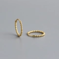 Detail of gold beaded hoop earrings featuring a minimalist textured dot design in S925 silver - 12mm / 925 Silver / Gold