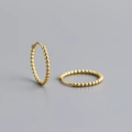 Detailed close-up of golden beaded hoop earrings made of sterling silver for women - 14mm / 925 Silver / Gold
