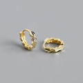 Close-up of S925 sterling silver earrings with textured leaf patterns and hallmarks - 925 Silver / Gold