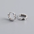 Close-up of S925 sterling silver earrings showing detailed leaf pattern and hallmark - 925 Silver / White Gold
