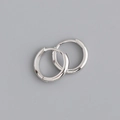 Macro detail of polished 925 sterling silver hoop earrings with high mirror finish - 14mm / Silver