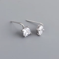 Detail of square-cut clear zircon stone in a 4-prong silver stud earring setting - Clear White (Silver)
