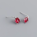 Macro shot of S925 sterling silver stud earrings with square-cut red zircon stones - Ruby Red (Silver)