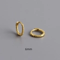Detail shot of 6mm mini twisted rope gold hoop earrings with secure hinged closure - Number 6 / Gold