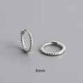 Detail showing 8mm silver twisted rope hoop earrings with S925 sterling silver finish - Number 8 / White Gold