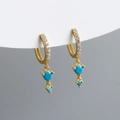 Macro shot of gold hoop earrings with white zircon fringe and turquoise-colored stones - 925 Silver / Turquoise (Gold Tone)