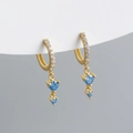 Detail of gold hoop earrings with white zircon pavé and dangling sky blue gemstones - 925 Silver / Light Blue (Gold Tone)