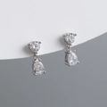 Detailed close-up of S925 silver stud earrings with pear-cut teardrop cubic zirconia - Clear White (Silver)