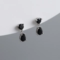 Detailed macro shot of S925 silver stud earrings with black pear-cut cubic zirconia - Black Zirconia (Silver)