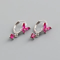 Macro shot of S925 sterling silver stamp on pink butterfly earrings with zirconia stones - Ruby Red (Silver)