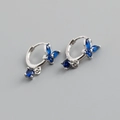 Macro view of S925 sterling silver butterfly earrings with sparkling blue zircons - Blue Stone (Platinum)