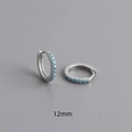 Detail of 12mm S925 sterling silver huggie earrings with turquoise blue cubic zirconia - 925 Silver / 12mm / White Gold