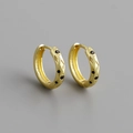 Macro shot of gold S925 sterling silver hoop earrings with black zircon geometric textures - Gold Color (Black Stone)