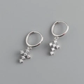 Macro shot of silver S925 cross hoop earrings featuring high-quality white zircon stones - 925 Silver / White Zircon (Platinum)