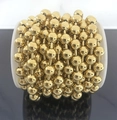 Close-up of 6mm and 8mm 18K gold plated stainless steel ball chain on a spool - 6mm Ball Chain / Gold (Vacuum Plated)